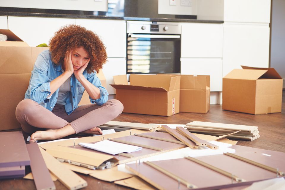 Women on floor looking at reno material mistakes
